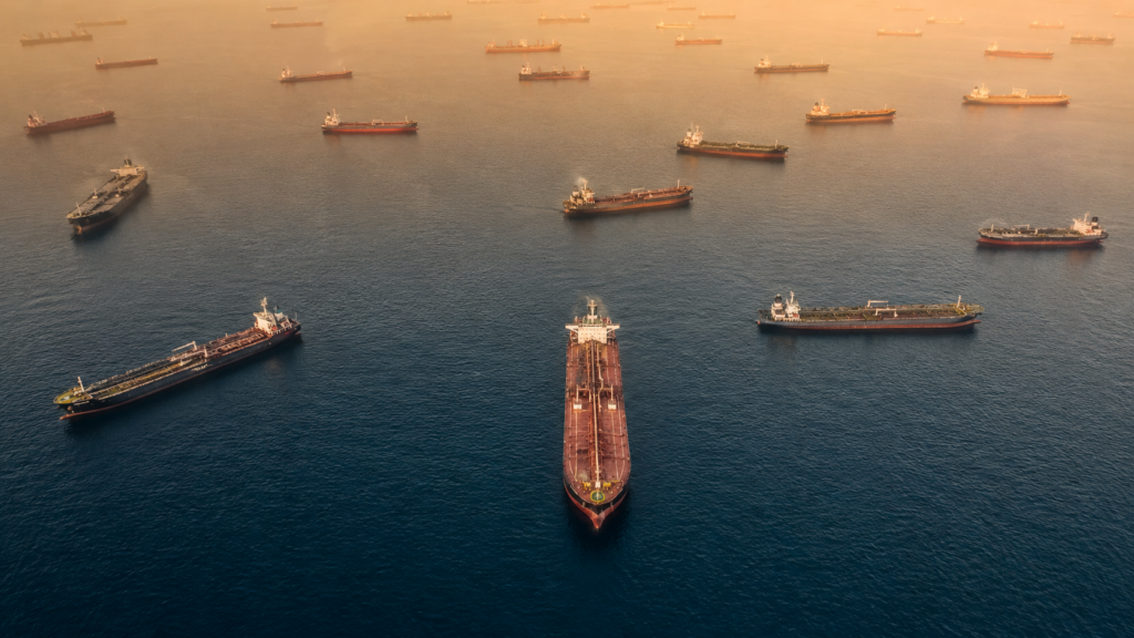 Image of oil tankers in gridlock floating in the water, representing the transit problems in the Strait of Hormuz.