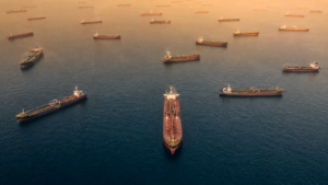 Image of oil tankers in gridlock floating in the water, representing the transit problems in the Strait of Hormuz.
